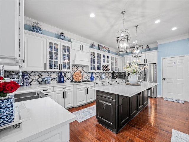 7060 Summit Rdg, Chase, Cumming, GA 30041 - kitchen featuring freestanding refrigerator, light countertops, gas cooktop, white cabinets, and tasteful backsplash