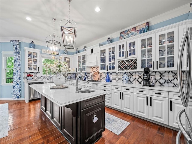 7060 Summit Rdg, Chase, Cumming, GA 30041 - kitchen with stainless steel appliances, a sink, light countertops, a kitchen island with sink, and ornamental molding