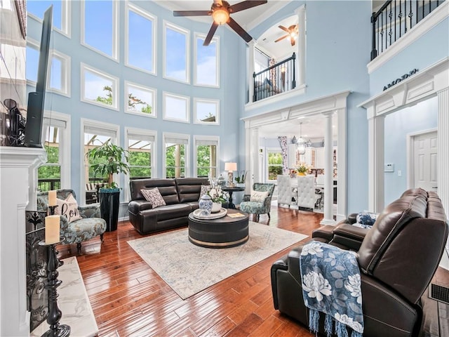 7060 Summit Rdg, Chase, Cumming, GA 30041 - living area featuring a high ceiling, a ceiling fan, and wood finished floors