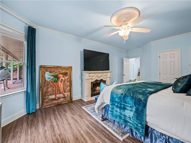 7060 Summit Rdg, Chase, Cumming, GA 30041 - bedroom featuring wood finished floors, baseboards, ornamental molding, arched walkways, and ceiling fan