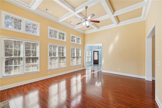 2143 Great Shoals Cir, Lawrenceville, GA 30045 - empty room featuring dark wood-style floors, visible vents, a towering ceiling, baseboards, and ceiling fan with notable chandelier