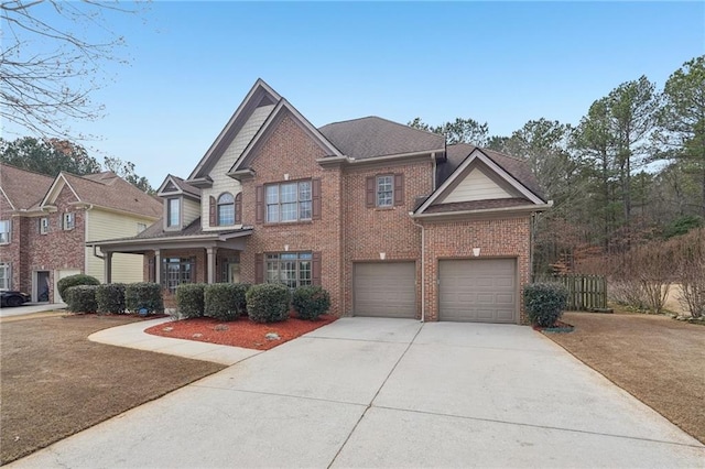 2143 Great Shoals Cir, Lawrenceville, GA 30045 - view of front of house featuring a garage, driveway, brick siding, and a front yard