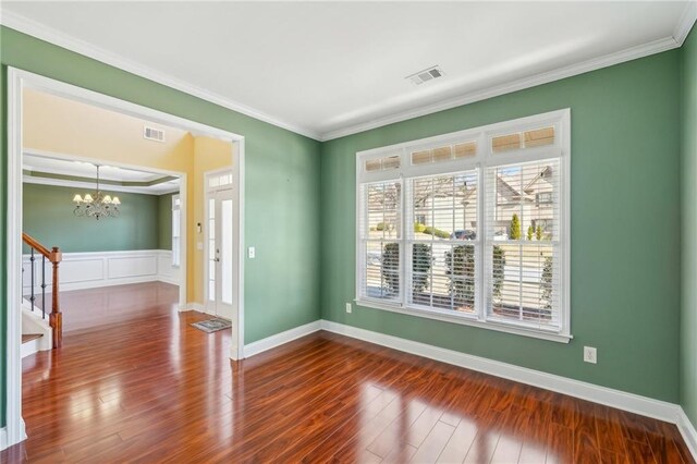 2143 Great Shoals Cir, Lawrenceville, GA 30045 - unfurnished room with ornamental molding, wood finished floors, and visible vents