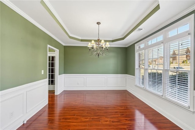2143 Great Shoals Cir, Lawrenceville, GA 30045 - unfurnished room featuring a wainscoted wall, dark wood finished floors, a raised ceiling, visible vents, and a chandelier