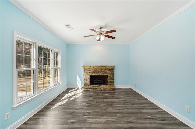 2143 Great Shoals Cir, Lawrenceville, GA 30045 - unfurnished living room with dark wood-style floors, crown molding, a stone fireplace, and baseboards
