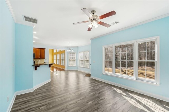 2143 Great Shoals Cir, Lawrenceville, GA 30045 - unfurnished living room with visible vents, crown molding, and baseboards