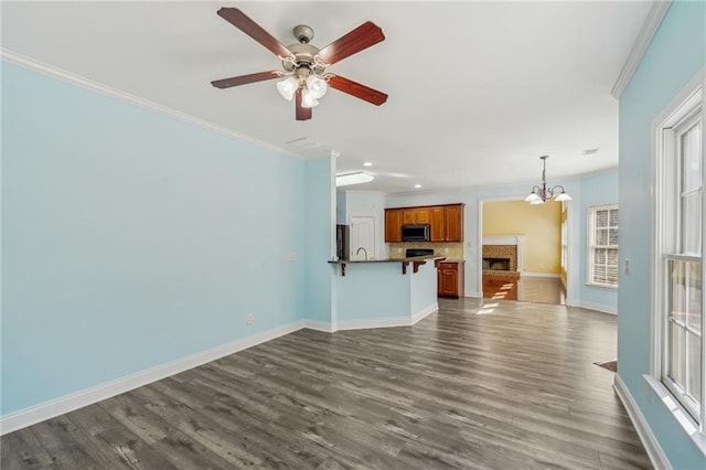 2143 Great Shoals Cir, Lawrenceville, GA 30045 - unfurnished living room with ornamental molding, dark wood finished floors, and baseboards