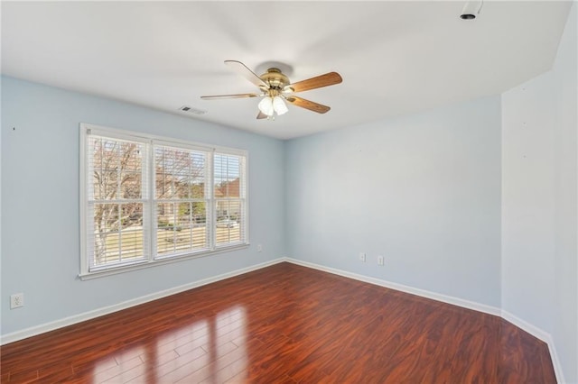 2143 Great Shoals Cir, Lawrenceville, GA 30045 - spare room with ceiling fan, wood finished floors, visible vents, and baseboards