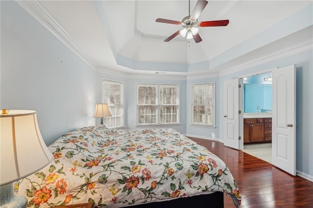 2143 Great Shoals Cir, Lawrenceville, GA 30045 - bedroom featuring light wood finished floors, baseboards, connected bathroom, a tray ceiling, and crown molding