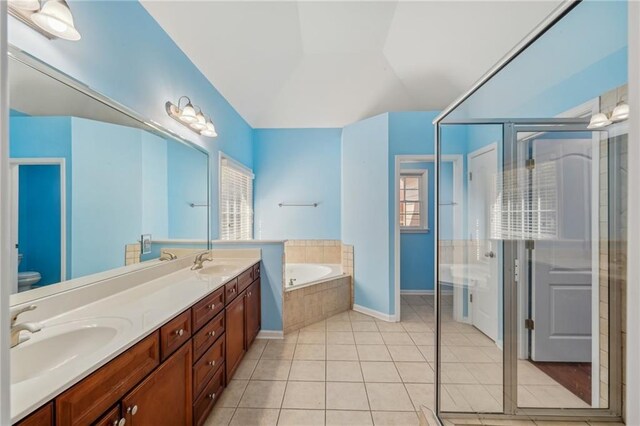 2143 Great Shoals Cir, Lawrenceville, GA 30045 - bathroom with a stall shower, tile patterned flooring, a garden tub, and a sink