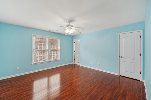 2143 Great Shoals Cir, Lawrenceville, GA 30045 - unfurnished room with dark wood-type flooring, visible vents, ceiling fan, and baseboards