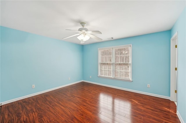 2143 Great Shoals Cir, Lawrenceville, GA 30045 - empty room featuring dark wood-type flooring, visible vents, baseboards, and a ceiling fan