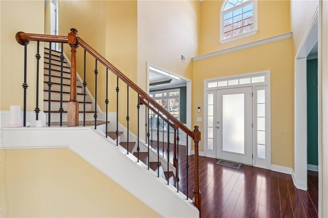 2143 Great Shoals Cir, Lawrenceville, GA 30045 - entryway featuring dark wood-style flooring, baseboards, visible vents, and a high ceiling