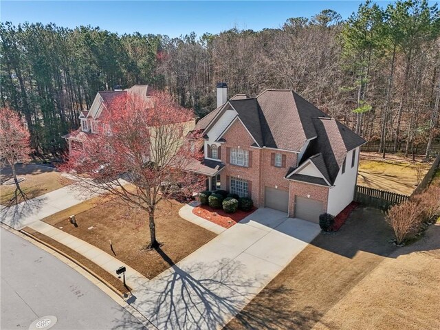 2143 Great Shoals Cir, Lawrenceville, GA 30045 - bird's eye view with a forest view