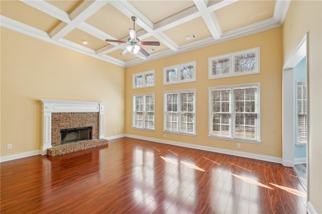 2143 Great Shoals Cir, Lawrenceville, GA 30045 - unfurnished living room featuring a fireplace, visible vents, a ceiling fan, wood finished floors, and baseboards