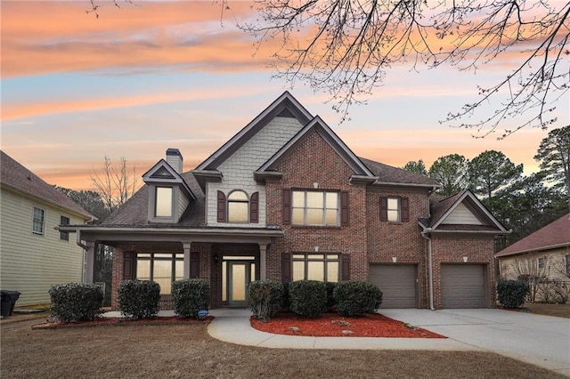 2143 Great Shoals Cir, Lawrenceville, GA 30045 - view of front of house featuring a chimney, concrete driveway, and brick siding