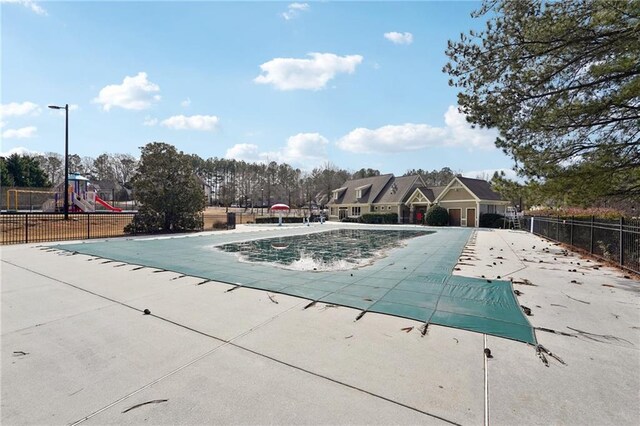 2143 Great Shoals Cir, Lawrenceville, GA 30045 - pool featuring a patio area, playground community, and fence