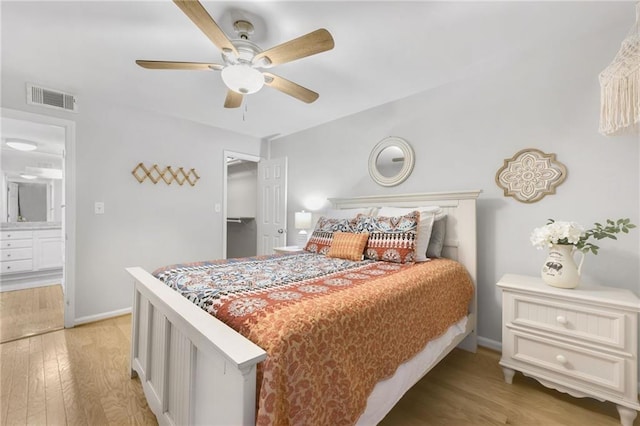 bedroom with ceiling fan and light hardwood / wood-style floors