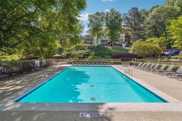 view of swimming pool featuring a patio area