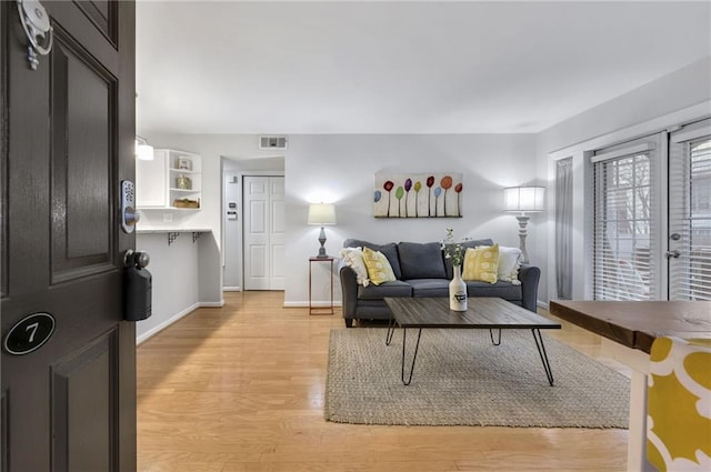 living room with light hardwood / wood-style floors