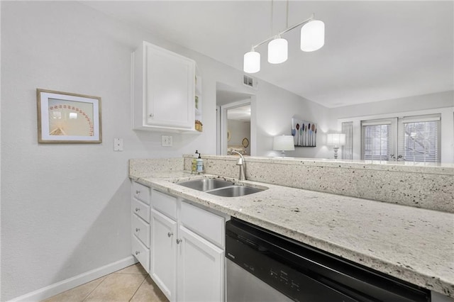 kitchen featuring sink, dishwasher, white cabinets, light tile patterned flooring, and decorative light fixtures