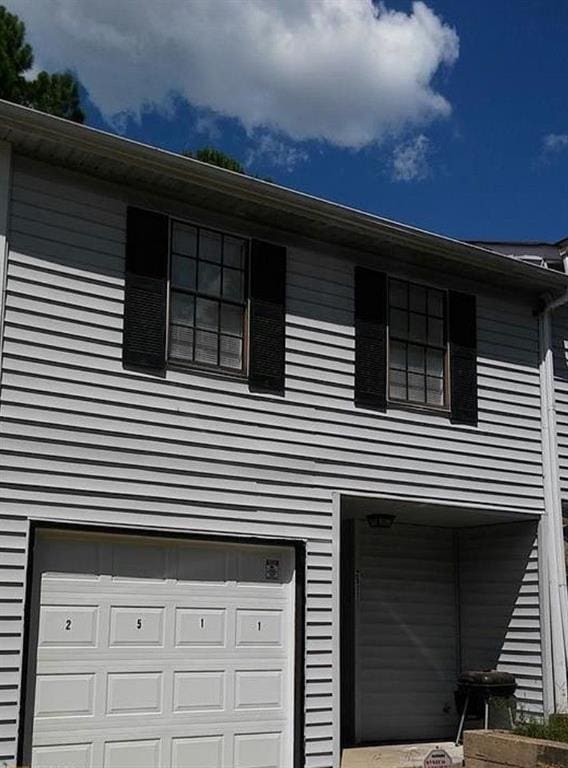 view of home's exterior with a garage