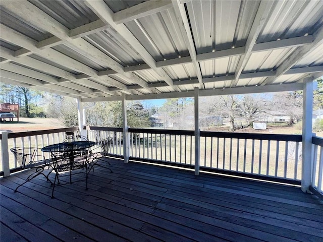 wooden terrace with outdoor dining area