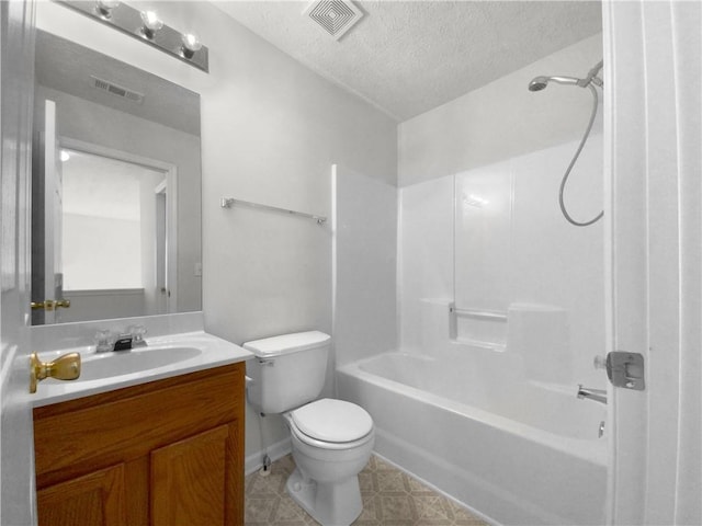 full bathroom featuring vanity, a textured ceiling, toilet, and shower / bathtub combination