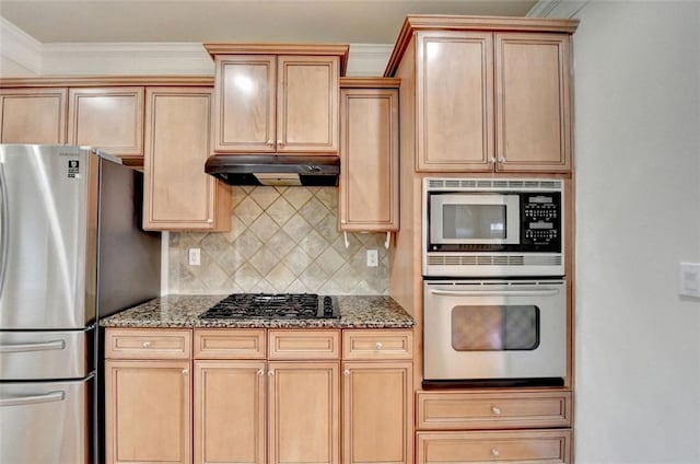 kitchen with stone counters, backsplash, light brown cabinetry, appliances with stainless steel finishes, and under cabinet range hood