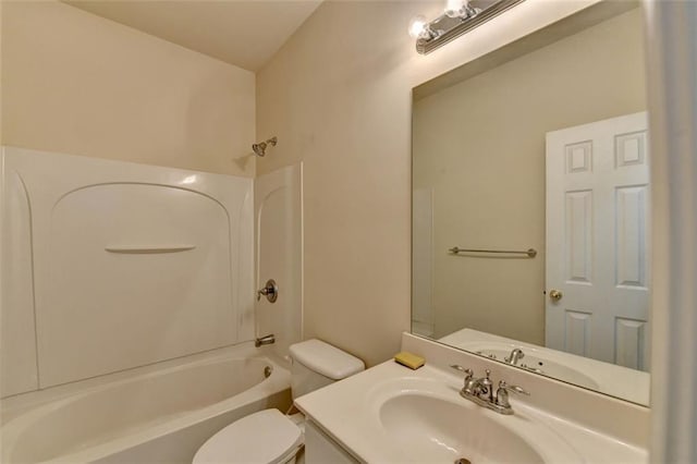 bathroom with vanity, bathtub / shower combination, and toilet