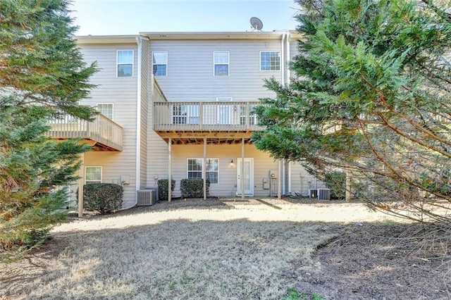 back of house featuring central AC unit