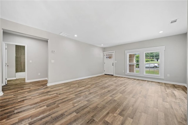 unfurnished living room with light hardwood / wood-style floors