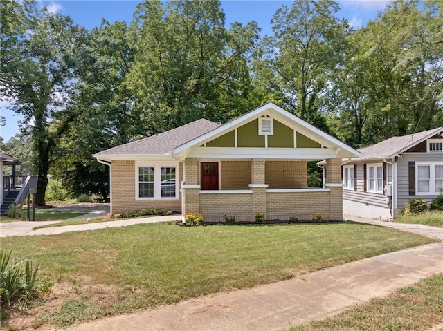 view of front facade with a porch and a front lawn