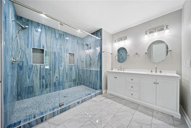 bathroom with vanity and a shower with door