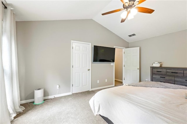 carpeted bedroom featuring a ceiling fan, visible vents, vaulted ceiling, and baseboards