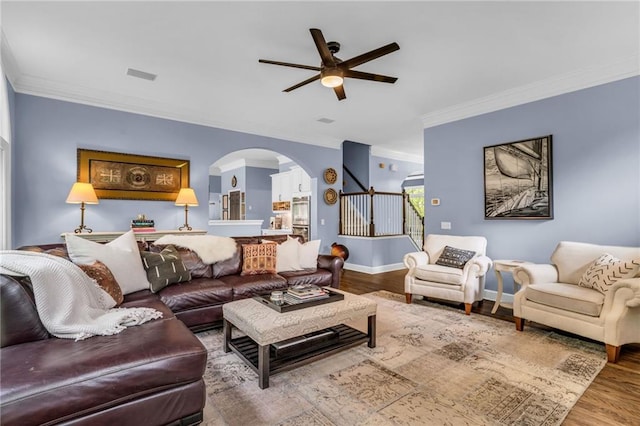 4020 Devereux Chase, Roswell, GA 30075 - living area with a ceiling fan, arched walkways, crown molding, stairway, and wood finished floors