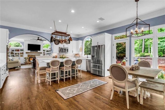 4020 Devereux Chase, Roswell, GA 30075 - dining area with ornamental molding, recessed lighting, ceiling fan, arched walkways, and a chandelier