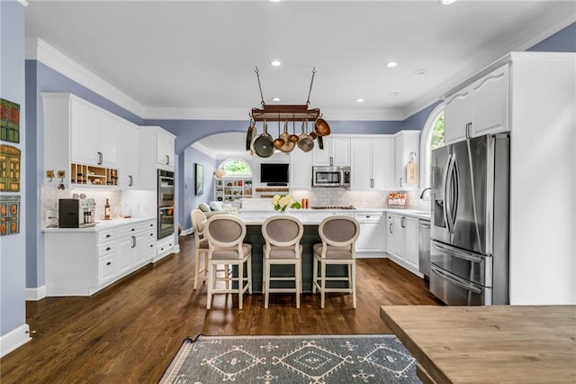 4020 Devereux Chase, Roswell, GA 30075 - kitchen with appliances with stainless steel finishes, white cabinetry, backsplash, recessed lighting, and ornamental molding