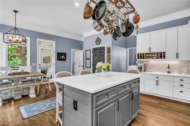4020 Devereux Chase, Roswell, GA 30075 - kitchen with gray cabinetry, a chandelier, white cabinetry, crown molding, and tasteful backsplash