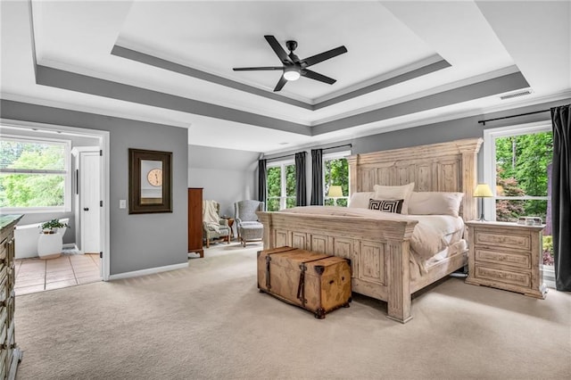 4020 Devereux Chase, Roswell, GA 30075 - bedroom featuring a tray ceiling, crown molding, multiple windows, and light colored carpet