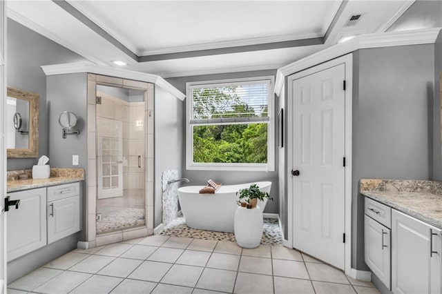4020 Devereux Chase, Roswell, GA 30075 - bathroom with vanity, crown molding, a shower stall, a freestanding bath, and tile patterned floors