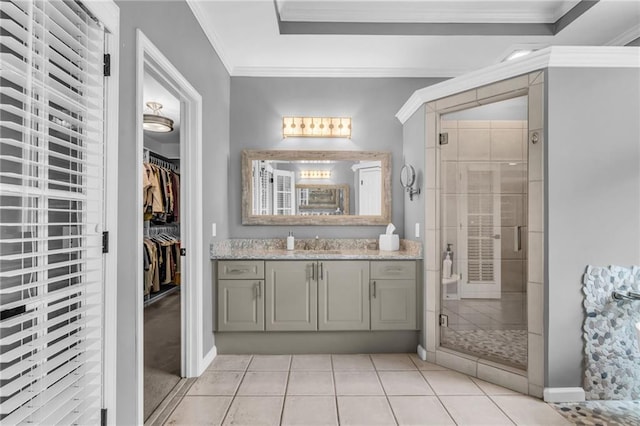 4020 Devereux Chase, Roswell, GA 30075 - bathroom with vanity, a shower stall, tile patterned flooring, a walk in closet, and crown molding