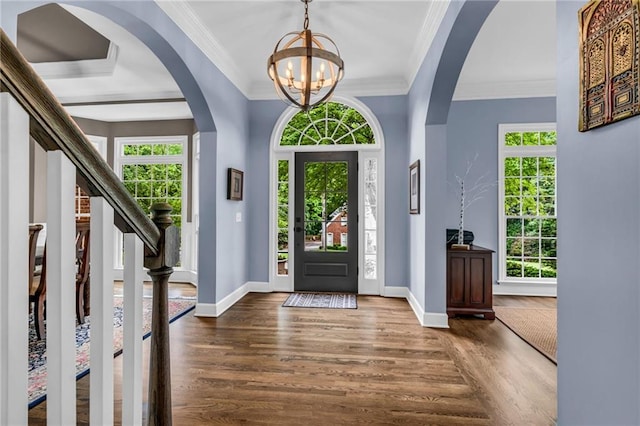 4020 Devereux Chase, Roswell, GA 30075 - entrance foyer with a chandelier, arched walkways, wood finished floors, baseboards, and crown molding