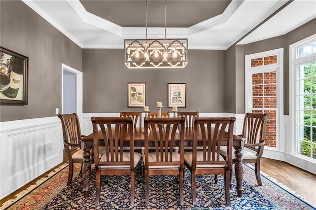 4020 Devereux Chase, Roswell, GA 30075 - dining room with a tray ceiling, wood finished floors, a chandelier, crown molding, and a wainscoted wall
