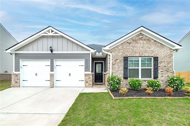 view of front of home with a front yard and a garage