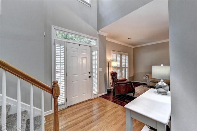 6520 Fairfield Trce, Suwanee, GA 30024 - foyer entrance with light wood-type flooring, crown molding, and stairs