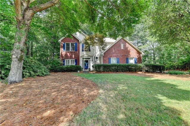 6520 Fairfield Trce, Suwanee, GA 30024 - view of front facade with brick siding and a front lawn