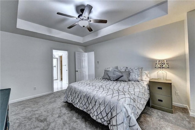 6520 Fairfield Trce, Suwanee, GA 30024 - bedroom featuring carpet, a tray ceiling, and a ceiling fan
