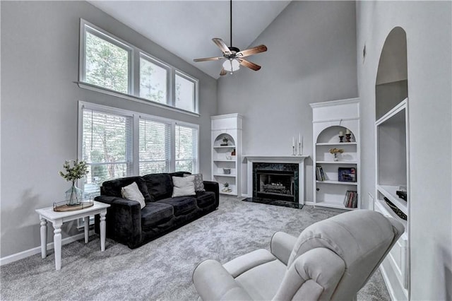 6520 Fairfield Trce, Suwanee, GA 30024 - living room with high vaulted ceiling, carpet flooring, ceiling fan, and a high end fireplace