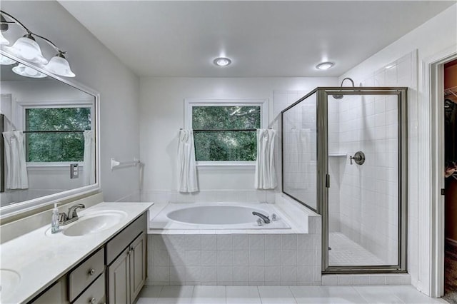 6520 Fairfield Trce, Suwanee, GA 30024 - bathroom featuring a bath, double vanity, a stall shower, and tile patterned floors